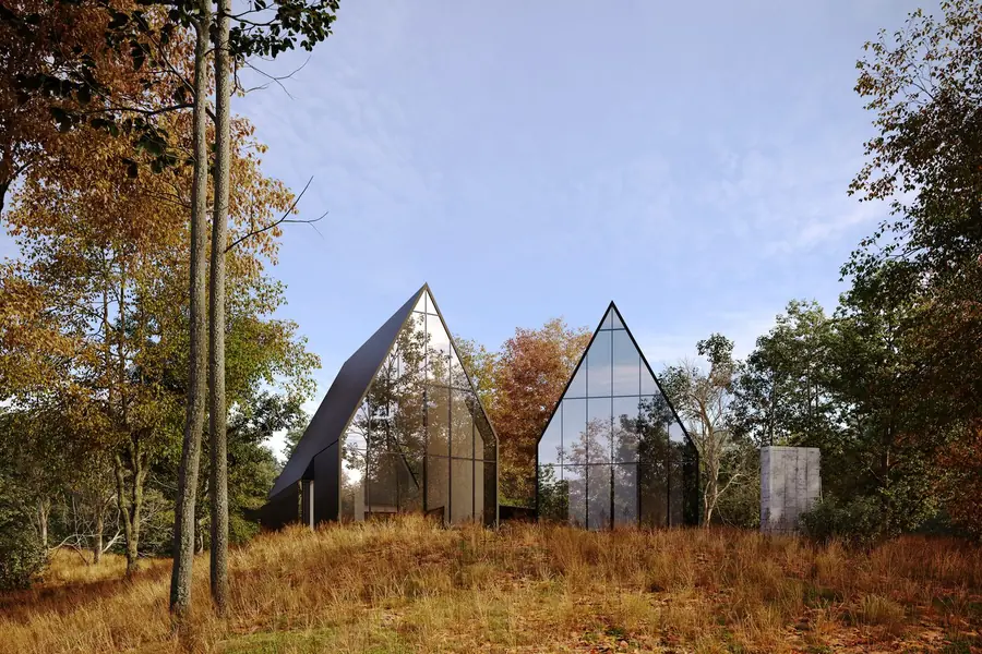 Two glass A-frame cabins in a golden autumn meadow with forest behind, exterior render